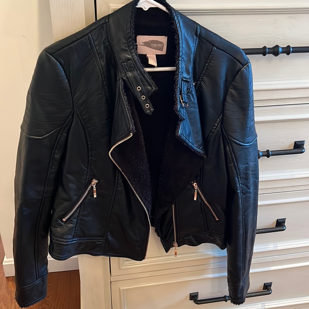 Fake leather jacket. Worn once! Inside of jacket is soft. Size L
